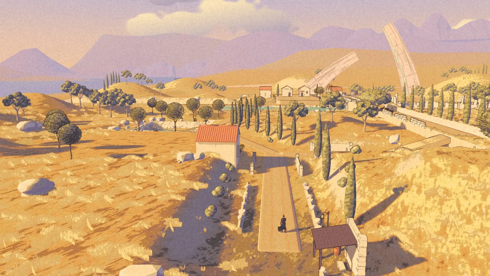 Kai on the road through golden hills, cypress trees and pale houses, with the Arc and lavender ranges beyond.